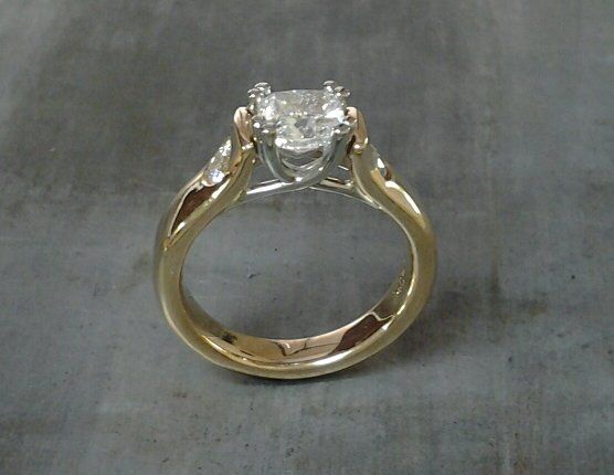 custom design 14k gold engagement ring with princess cut diamond and round cut accent diamonds side view