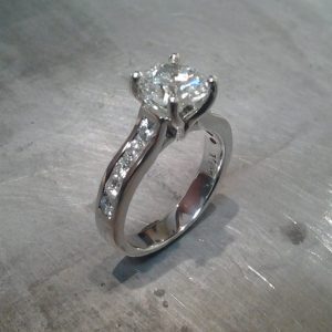 14k white gold engagement ring with princess cut diamond in cathedral setting and diamonds in band
