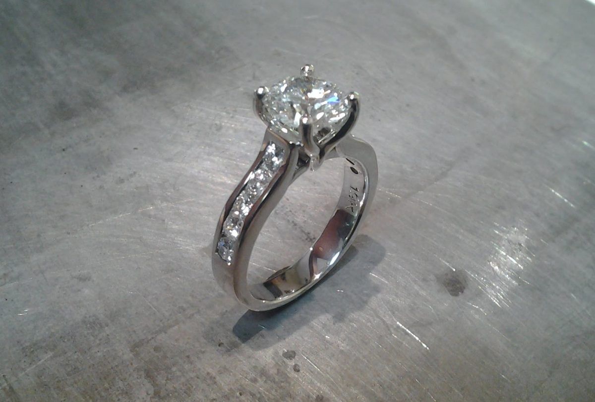 14k white gold engagement ring with princess cut diamond in cathedral setting and diamonds in band