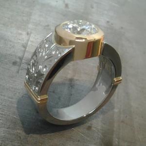 thick 14k gold and white gold engagement band with custom engraving and a round bezel set diamond side view