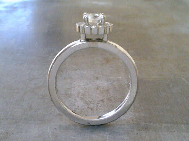 minimalist custom designed band with a princess cut diamond in a flower halo setting side view