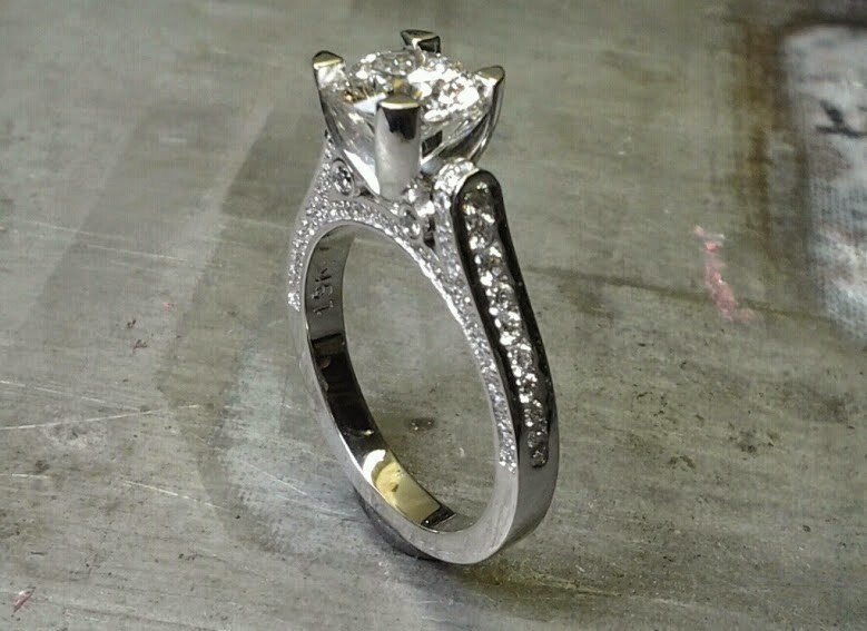 custom designed engagement ring with band embellishments and a cathedral set diamond side view