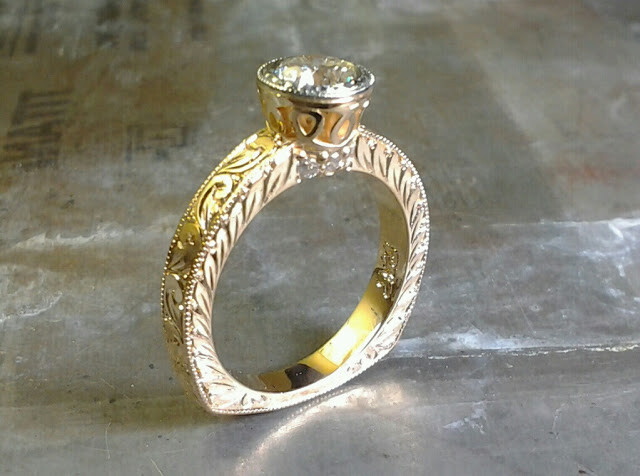 gold leaf filigree engagement ring with round diamond in bezel setting side view