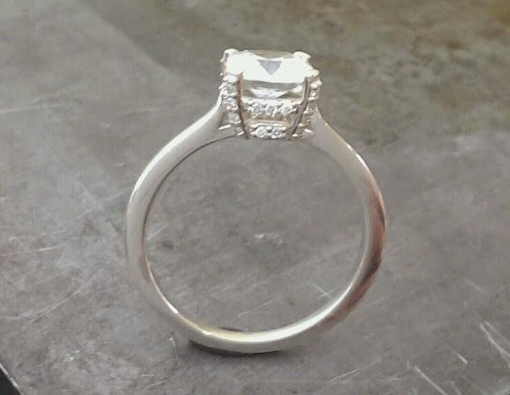 14k white gold slim band engagement ring with large princess cut diamond in a custom engraved channel setting 2