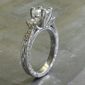 custom filigree white gold band with leaf accents and a triple cathedral set of diamonds with matching diamond band side view