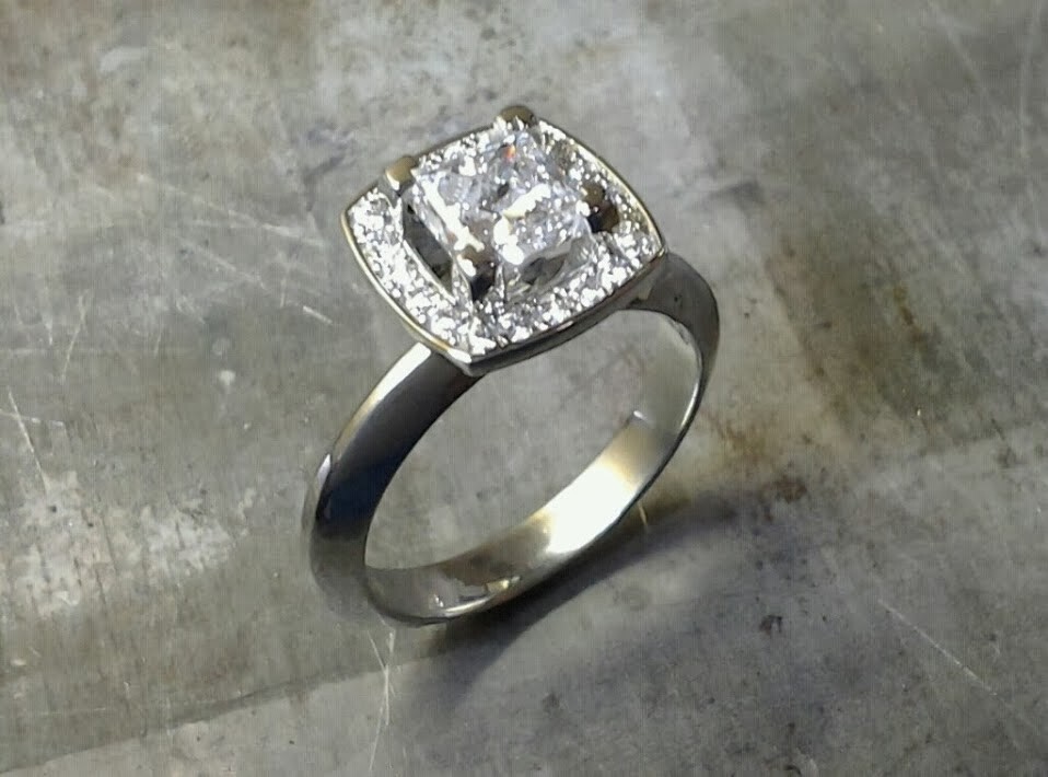 band with princess cut diamond in square halo setting