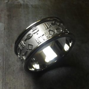 custom wedding ring with symbol engraving