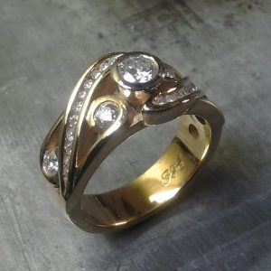 custom gold ring with many diamonds