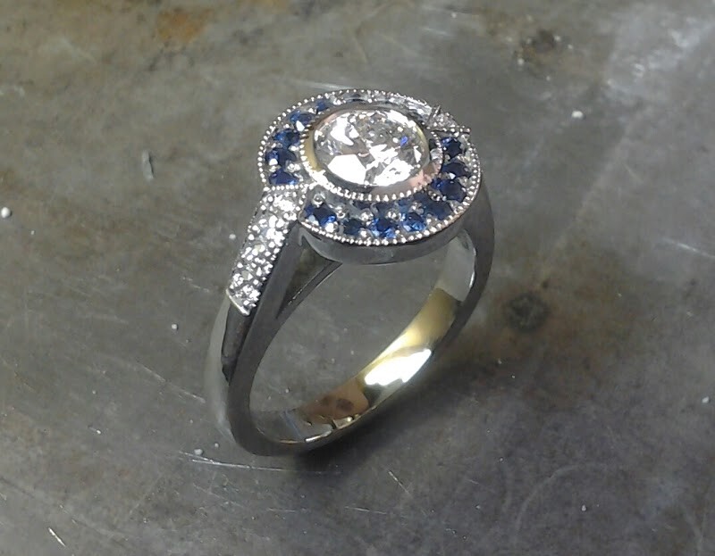 star wars inspired r2d2 white gold engagemnt ring with large round cut diamond and sapphire halo setting