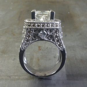diamond encrusted engagement ring with large center stone