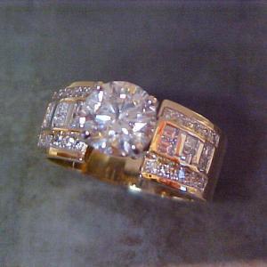 custom ring with gold and diamond bezel set band
