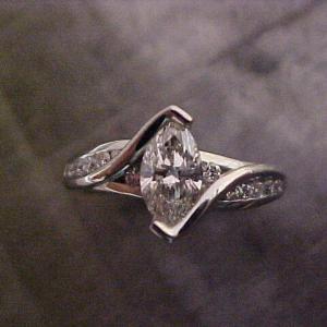 custom designed engagement ring with marquise diamond in tension setting top view