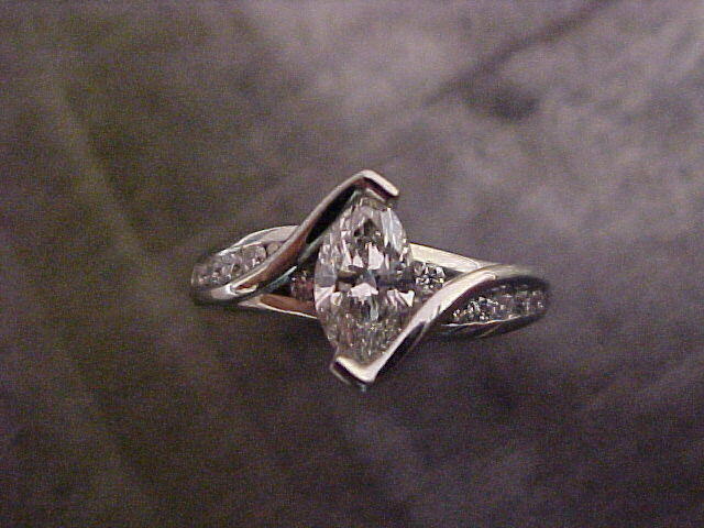 custom designed engagement ring with marquise diamond in tension setting top view