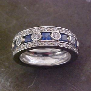 custom band with sapphires and round diamonds in bezel setting