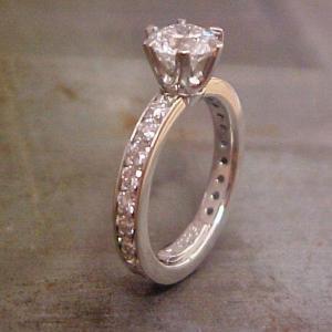 white gold engagement ring with princess cut diamond in deep cathedral setting