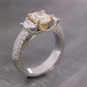 custom designed engagement ring with unique cut accent diamonds
