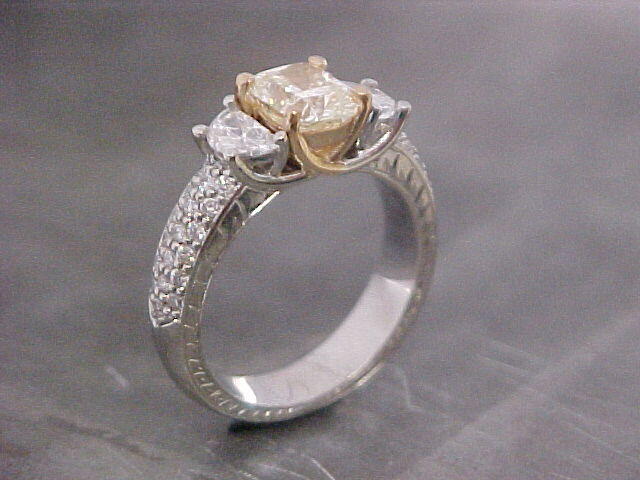 custom designed engagement ring with unique cut accent diamonds