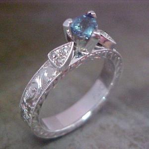 custom 14k white gold engagement ring with light blue center sapphire