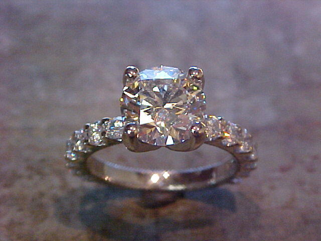 custom engagement ring with diamond band and large round diamond