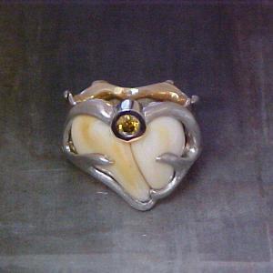 nature inspired ring with custom antler engraving, bone and yellow sapphire
