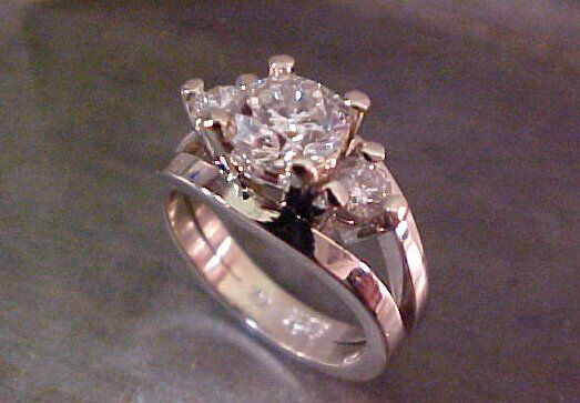 custom engagement ring with triple diamond setting by sean ferguson