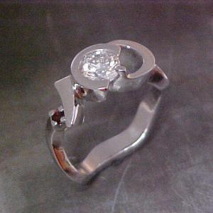 assymetrical band 14k white gold ring with rubies and diamond center stone