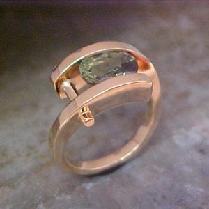 14k gold ring with emerald in tension setting