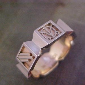 custom engraved symbols on wedding band with unique shape
