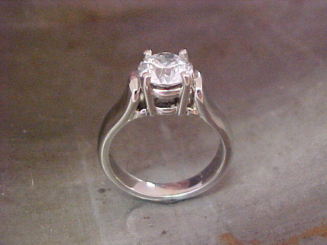 custom engagement ring with white gold and large round diamond