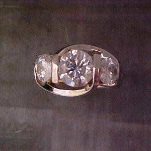 white gold custom ring with three large diamonds