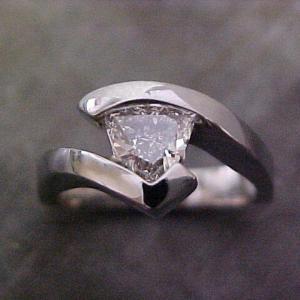 custom white gold engagement ring with tension set triangle diamond