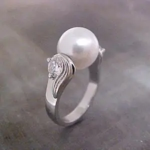 white gold ring with floating pearl