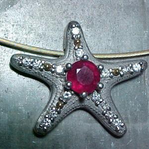 custom jewellery pendent with starfish design and rubies and diamonds
