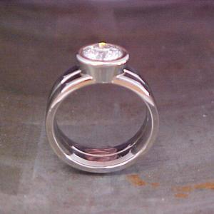 14k white gold custom engagement ring with large round diamond in center
