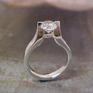 custom white gold engagement ring with tension set princess cut diamond