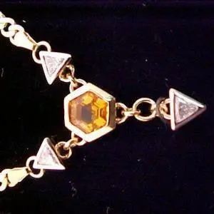 custom jewellery necklace with diamonds and yellow gem