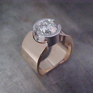 14k gold ring with large round diamond in white gold bezel setting