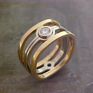 custom wedding ring with yellow and white gold and solitary round diamond