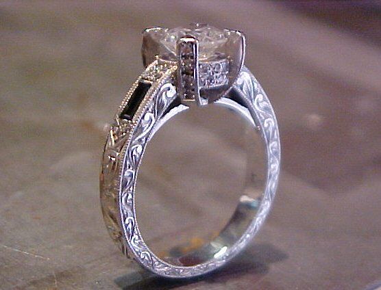 large custom engagement ring with engraved band and side accents