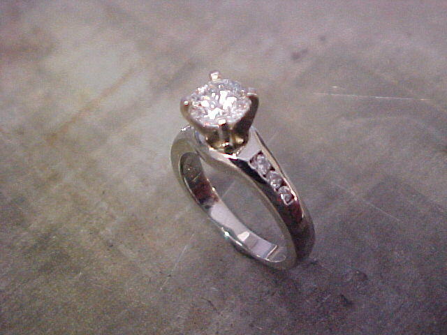 custom solitaire engagement ring with large princess cut diamond and side accents
