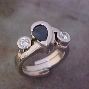14k white gold custom ring with teardrop shaped sapphire center gem