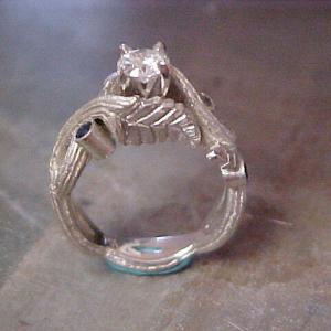 custom engagement ring with vine engraved band and saphire accents side view
