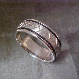 custom wedding band with black accents and engraving side view