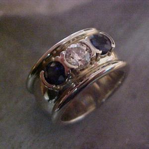 custom wide band ring with sapphires and center diamond