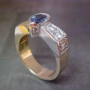 custom white gold ring with sapphire center stone