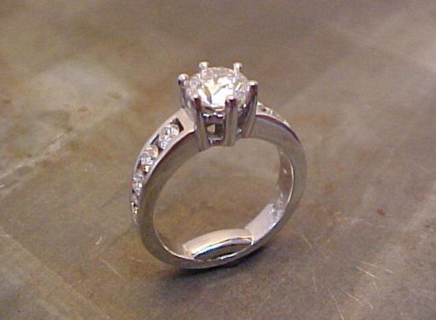 custom solitaire engagement ring with diamond accent band