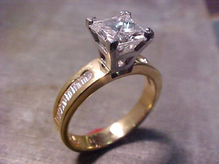 custom engagement ring with yellow gold band and white gold setting with large solitaire diamond