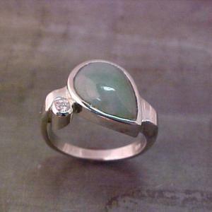 custom ring with teardrop center stone
