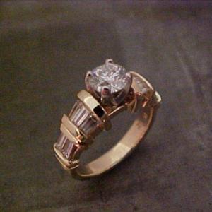 14k gold ring with large center diamond in channel setting