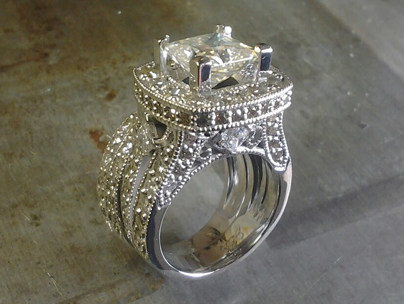 diamond encrusted engagement ring with large center stone side view